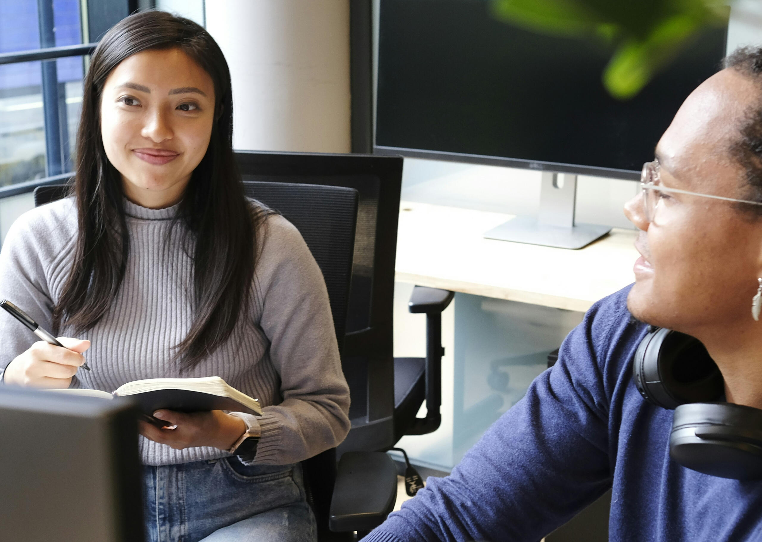 young lady smiling with coworker